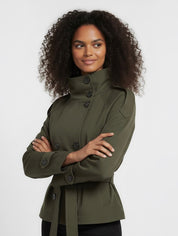 Beige Cath trench coat for women with a structured fit, high collar and dark buttons. Crafted from premium fabric, it highlights the waist and adds refined elegance to any autumn or winter outfit.