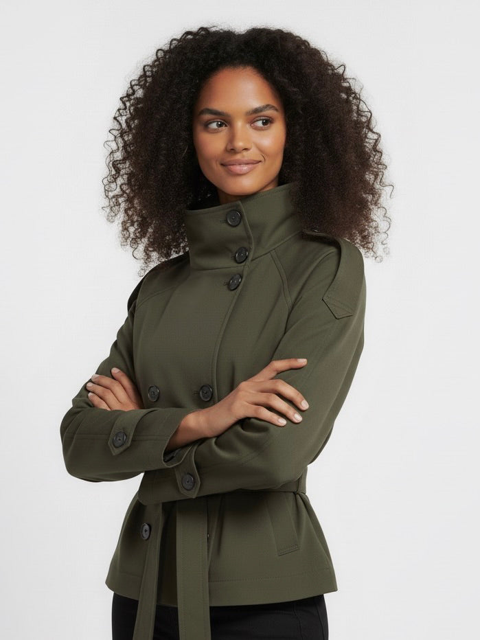 Beige Cath trench coat for women with a structured fit, high collar and dark buttons. Crafted from premium fabric, it highlights the waist and adds refined elegance to any autumn or winter outfit.