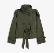 Beige Cath trench coat for women with a structured fit, high collar and dark buttons. Crafted from premium fabric, it highlights the waist and adds refined elegance to any autumn or winter outfit.