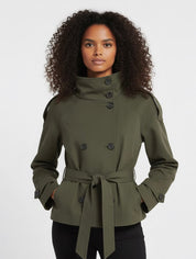 Beige Cath trench coat for women with a structured fit, high collar and dark buttons. Crafted from premium fabric, it highlights the waist and adds refined elegance to any autumn or winter outfit.