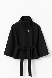 High-Neck Belted Cape Jacket in camel wool blend. Poncho-inspired autumn/winter coat with high-neck collar, cape silhouette and adjustable waist belt. A chic belted jacket combining elegance, comfort and versatile seasonal style.
