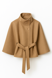 High-Neck Belted Cape Jacket in camel wool blend. Poncho-inspired autumn/winter coat with high-neck collar, cape silhouette and adjustable waist belt. A chic belted jacket combining elegance, comfort and versatile seasonal style.