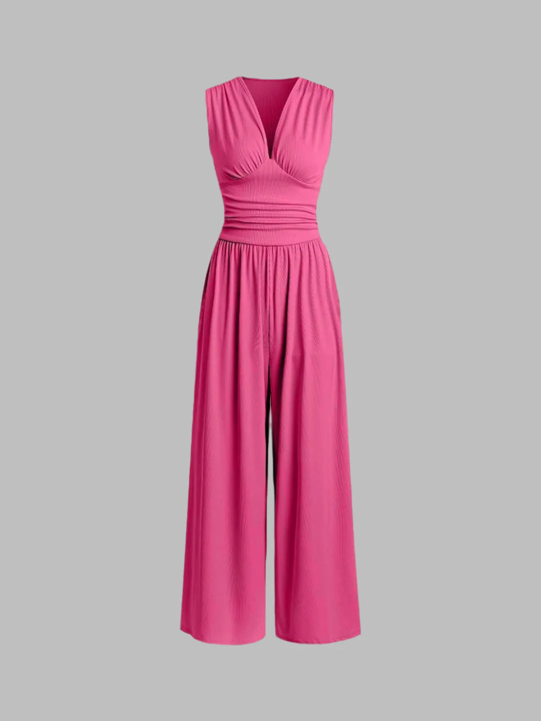Pink sleeveless jumpsuit with deep V neckline, ruched waist and wide-leg trousers