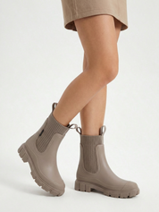 Apricot waterproof ankle boot with elastic side panels, pull tabs and chunky lug sole