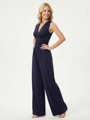 Navy sleeveless jumpsuit with deep V neckline, ruched waist and wide-leg trousers