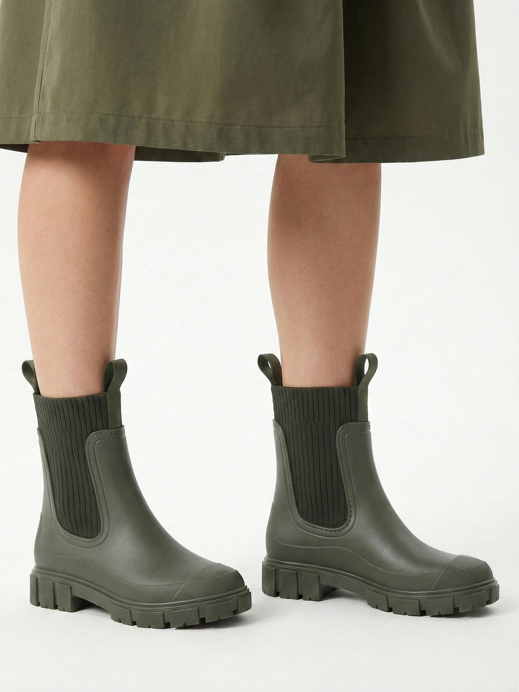 Green waterproof ankle boot with elastic side panels, pull tabs and chunky lug sole