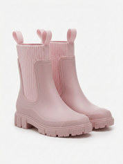 Pink waterproof ankle boot with elastic side panels, pull tabs and chunky lug sole