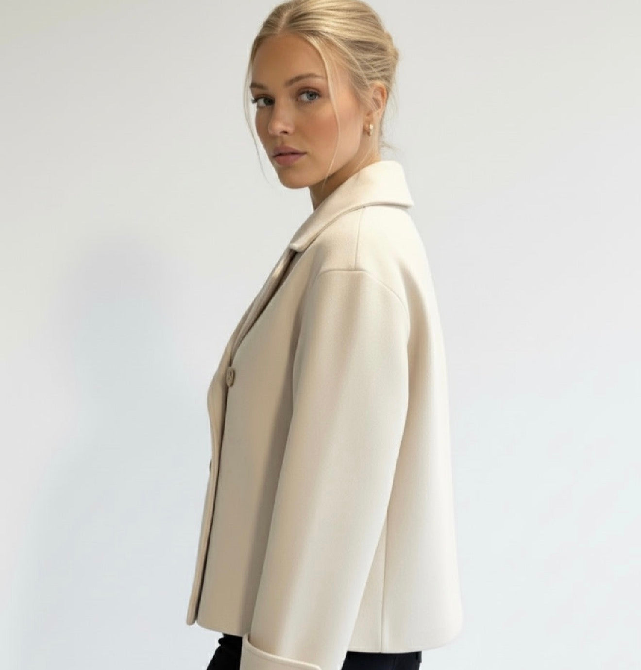 Wool Blend Double-Breasted Trench Coat for women. Features wide lapels, double front button fastening and structured tailoring. Ideal outerwear for autumn and winter layering with a refined, minimalist fit.