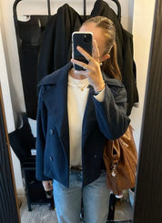 Wool Blend Double-Breasted Trench Coat for women. Features wide lapels, double front button fastening and structured tailoring. Ideal outerwear for autumn and winter layering with a refined, minimalist fit.