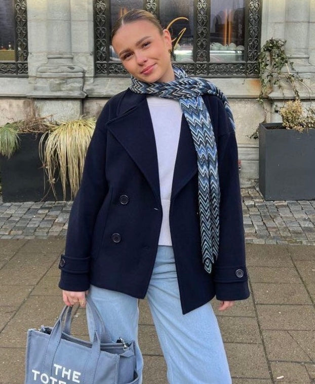 Wool Blend Double-Breasted Trench Coat for women. Features wide lapels, double front button fastening and structured tailoring. Ideal outerwear for autumn and winter layering with a refined, minimalist fit.