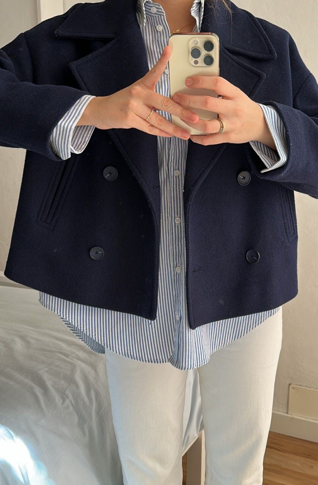 Wool Blend Double-Breasted Trench Coat for women. Features wide lapels, double front button fastening and structured tailoring. Ideal outerwear for autumn and winter layering with a refined, minimalist fit.