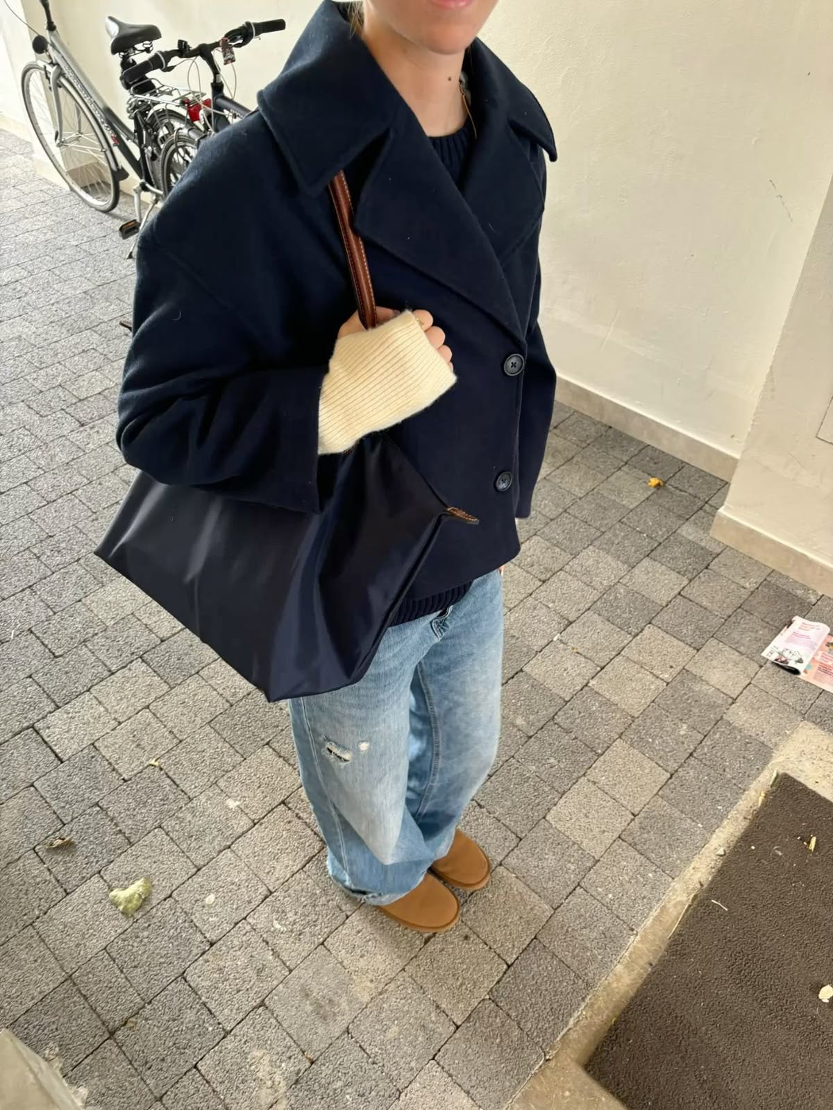 Wool Blend Double-Breasted Trench Coat for women. Features wide lapels, double front button fastening and structured tailoring. Ideal outerwear for autumn and winter layering with a refined, minimalist fit.